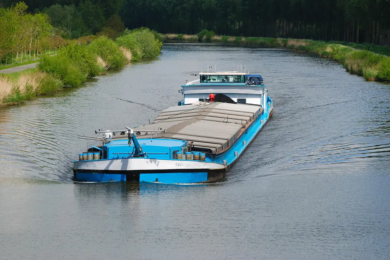 A loaded cargo barge on a river