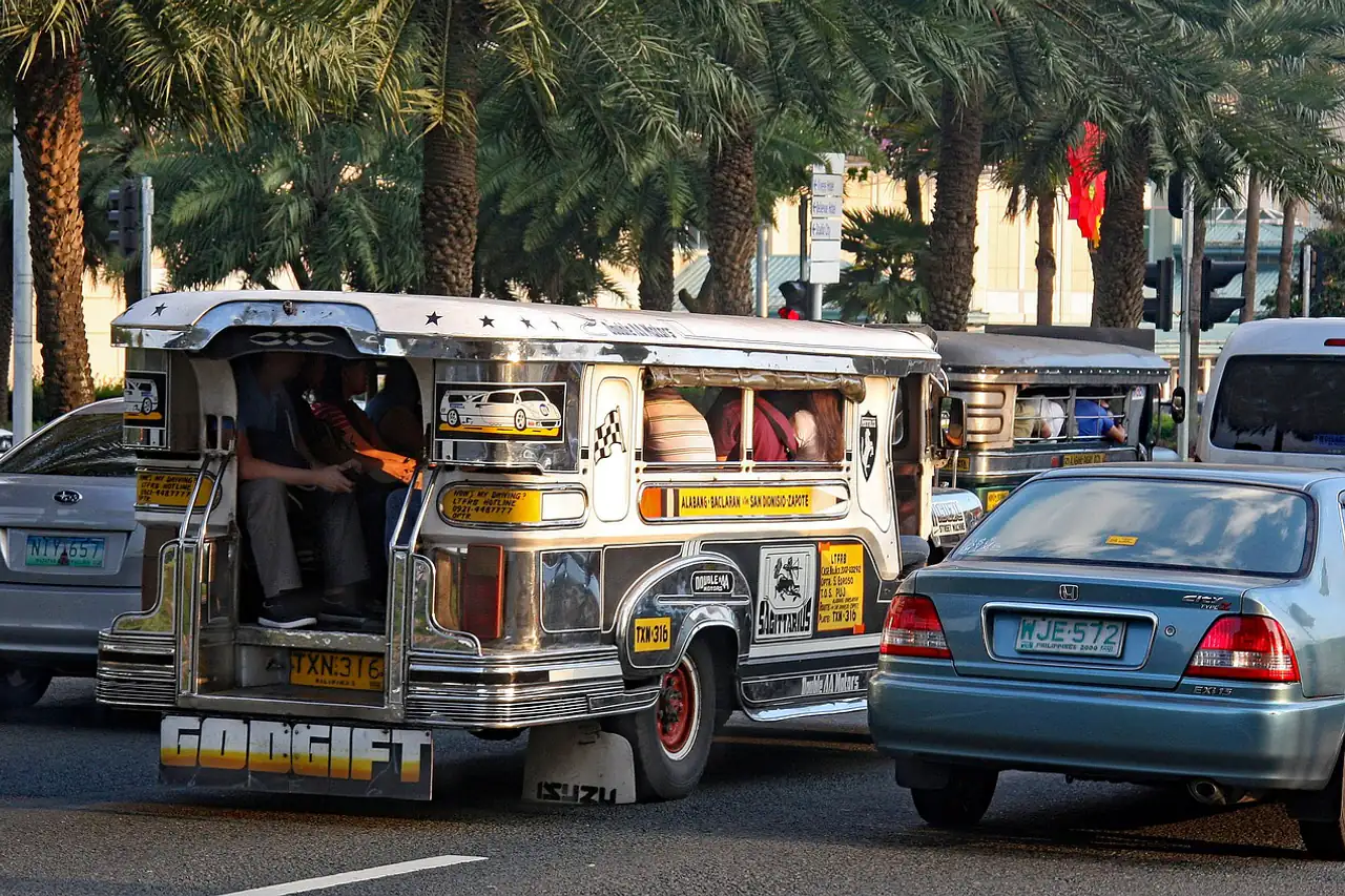 A jeepney in city traffic