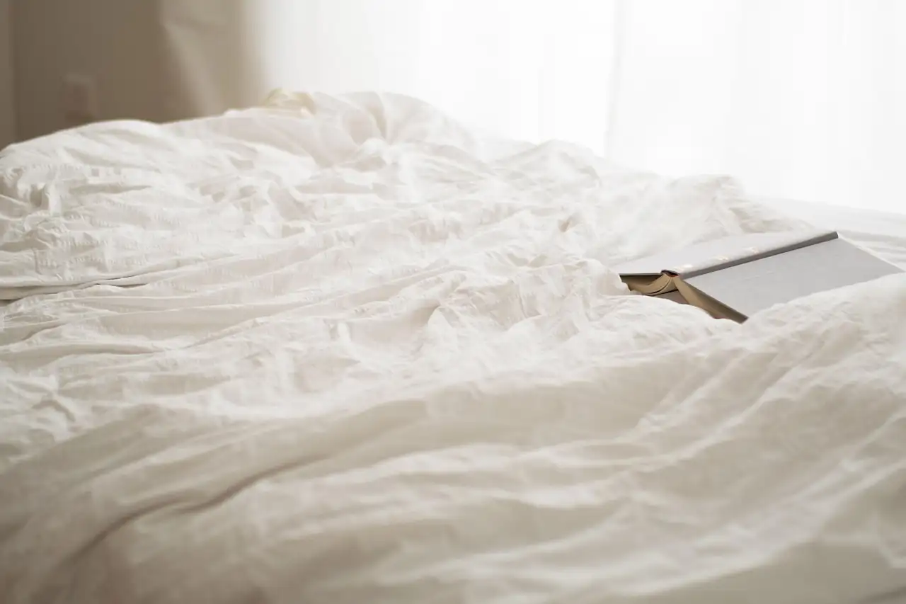 Rumpled white bed linen
