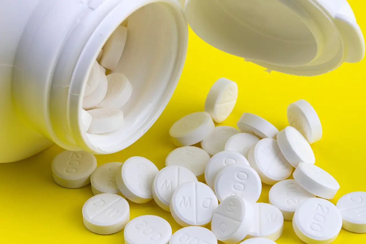 White tablets spilling from a bottle