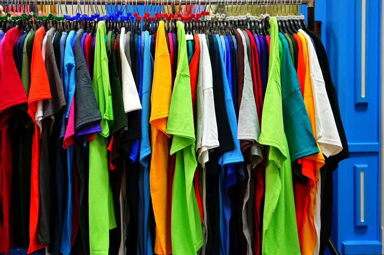 Cotton T-shirts in many colours on a rail