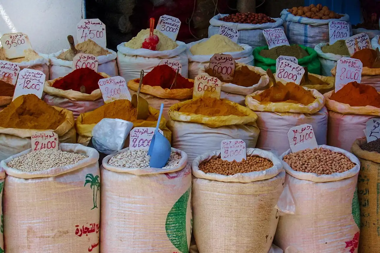 Open sacks of spices and grains at a market stall