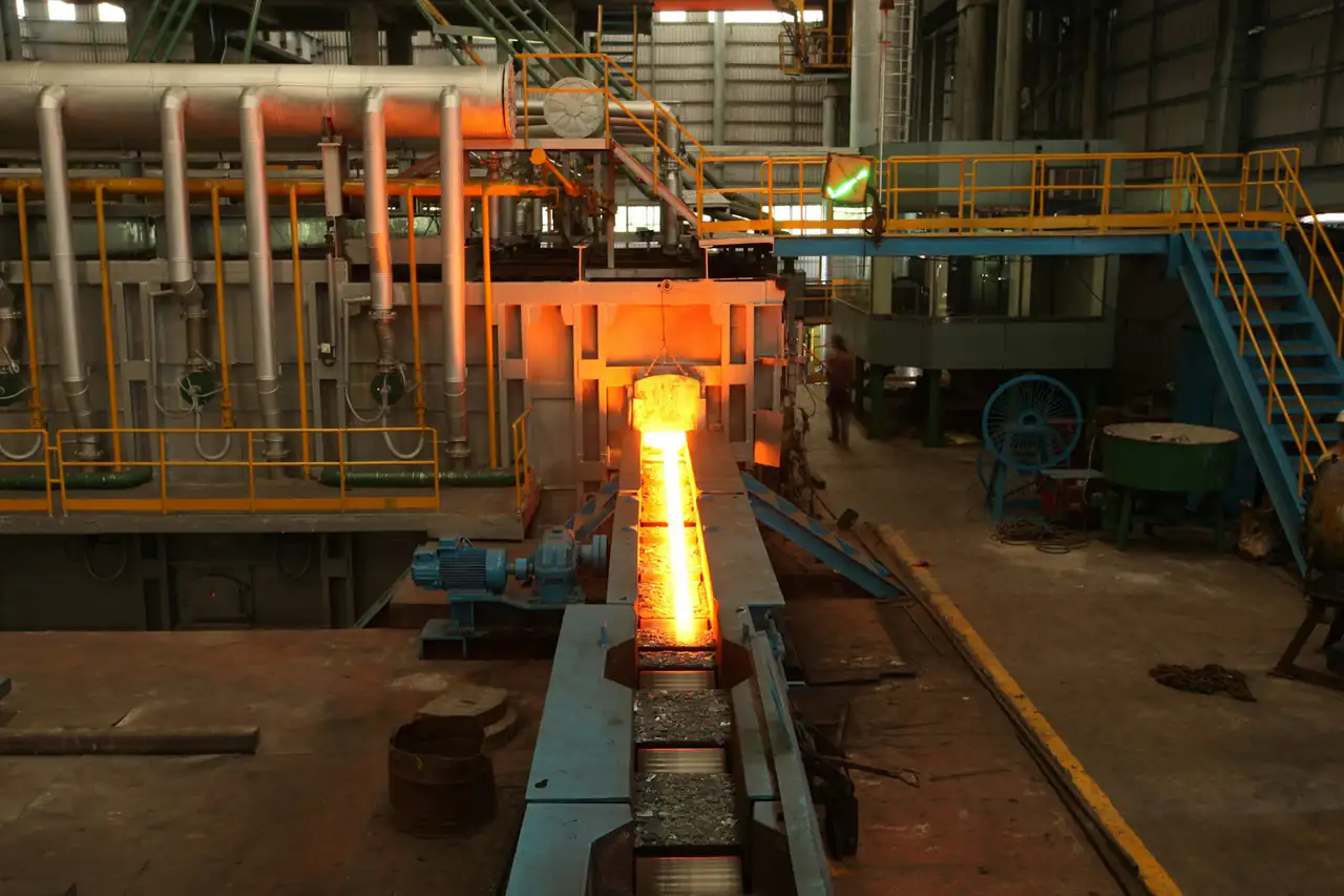 Hot steel moving through a rolling mill
