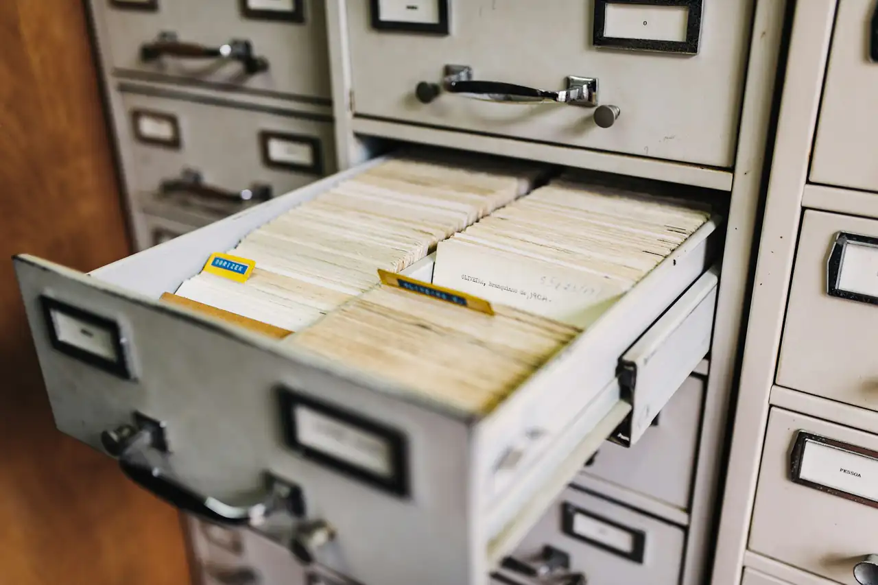 An open drawer of a filing cabinet full of records