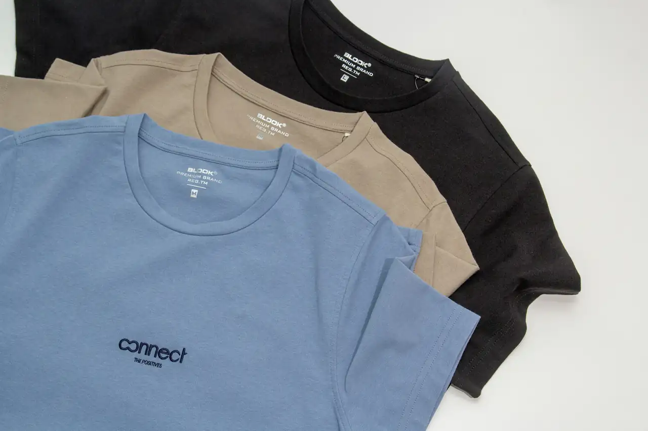 Plain T-shirts laid out in a row
