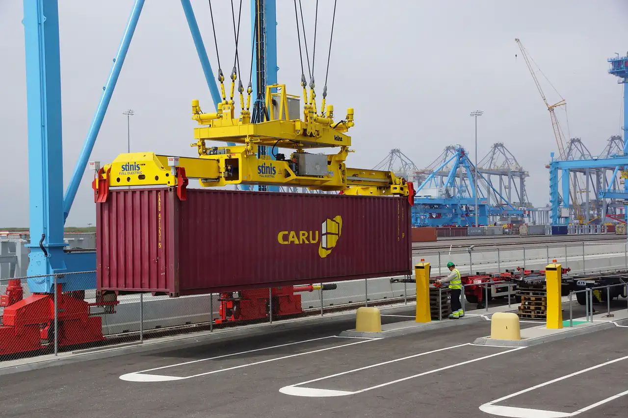 A container lifted onto a truck at a terminal