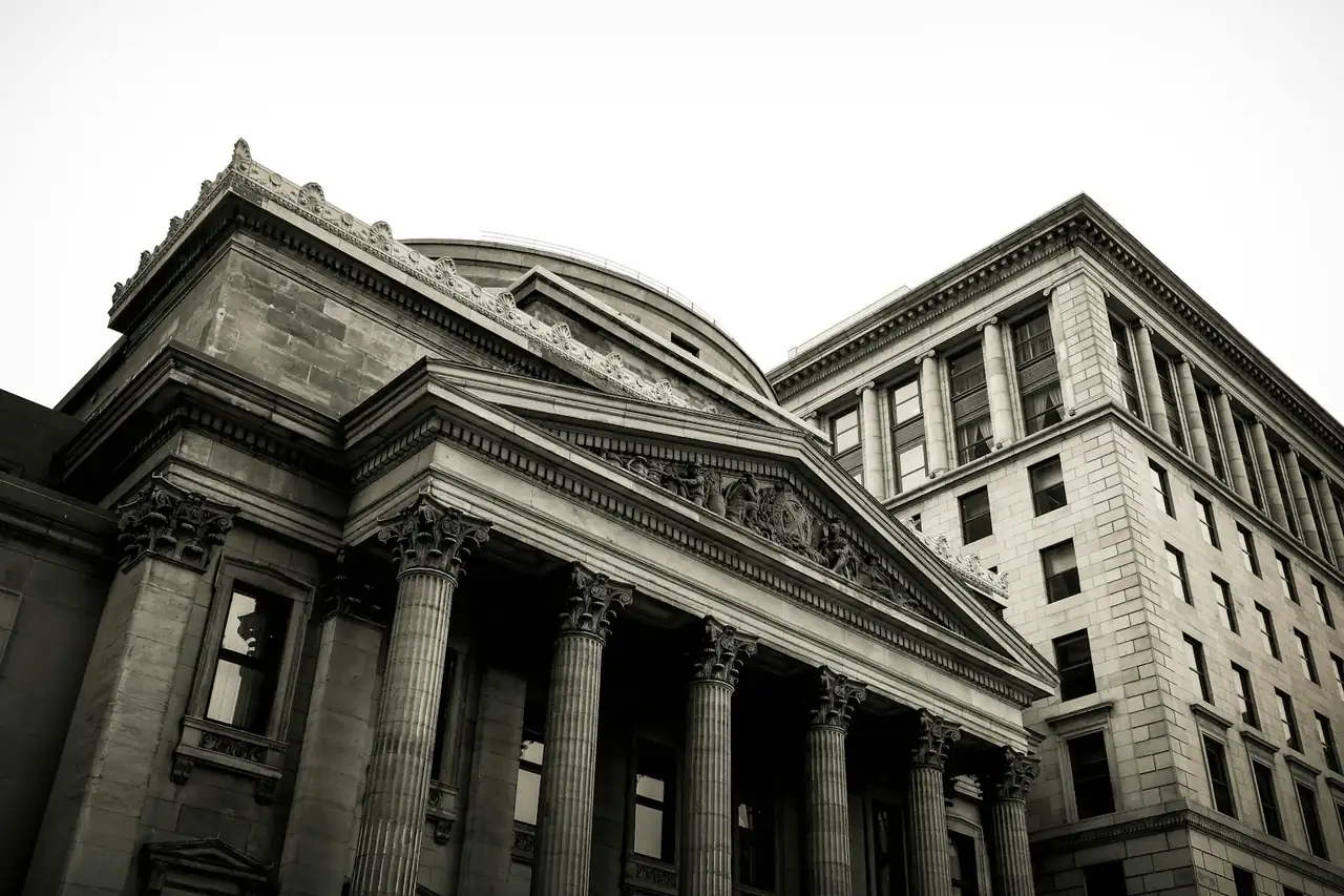 The columned front of an old bank building