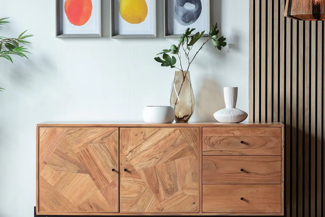 A wooden sideboard against a wall